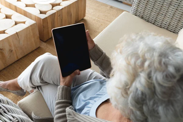 Mixed Race Senior Woman Sitting Sofa Using Tablet Staying Home — Stock Photo, Image