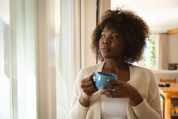 Thoughtful African American Woman Standing Dining Room Holding Cup Coffee — Stock Photo, Image