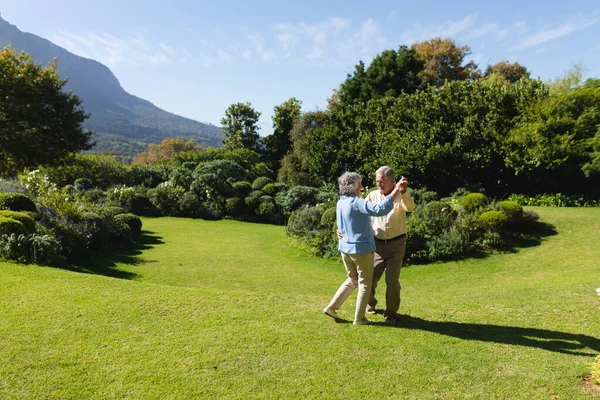 Senior Caucasian Couple Dancing Together Sunny Garden Retreat Retirement Happy — Stock Photo, Image