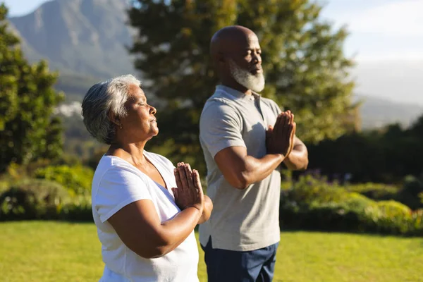 Senior African American Couple Meditating Practicing Yoga Eyes Closed Countryside —  Fotos de Stock