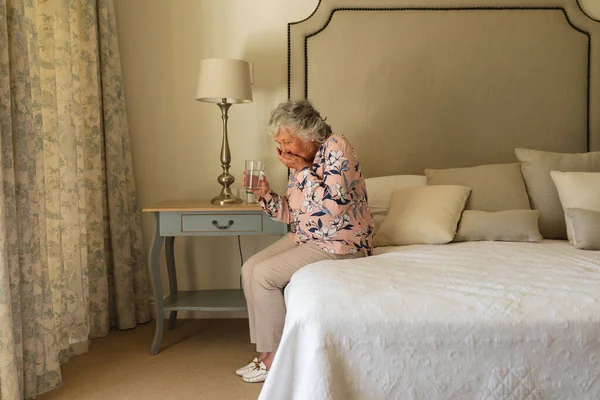 Senior Caucasian Woman Sitting Bed Holding Taking Pills Retreat Retirement — Stock Photo, Image