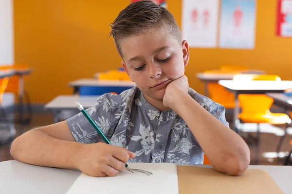 Caucasian Schoolboy Sitting Desk Classroom Drawing Pencil Book Childhood Education — Stock Photo, Image