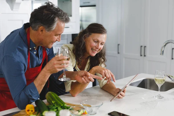 Happy Senior Caucasian Couple Kitchen Cooking Together Drinking Wine Using — Stock Photo, Image