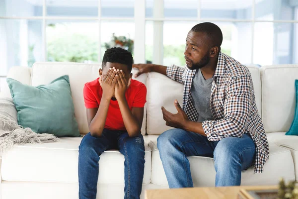 Sad African American Son Sitting Couch Covering Face Listening Father — Stock Photo, Image