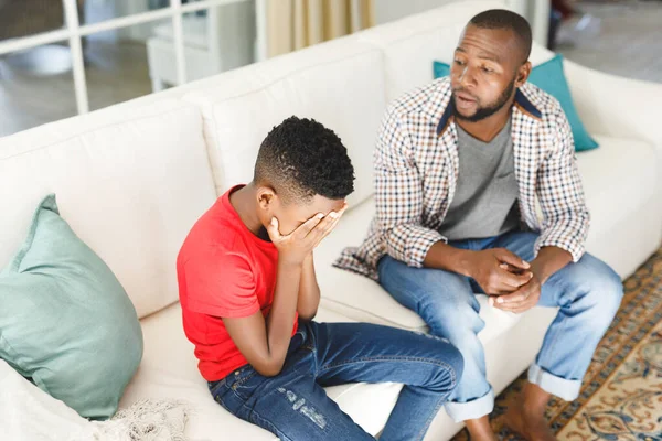 Sad African American Son Sitting Couch Covering Face Listening Father — Stock Photo, Image