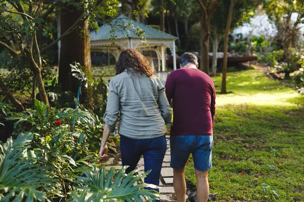 Happy Senior Caucasian Couple Holding Hands Sunny Garden Retirement Lifestyle — Stock Photo, Image