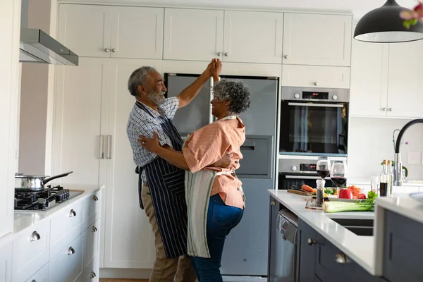 Happy Arfican American Senior Couple Dancing Together Kitchen Having Fun — Stock Photo, Image