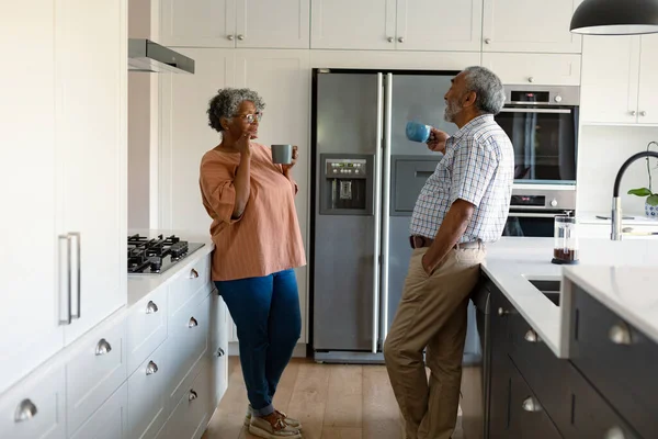 Happy African American Senior Couple Standing Kitchen Holding Mugs Coffee — Stock Photo, Image