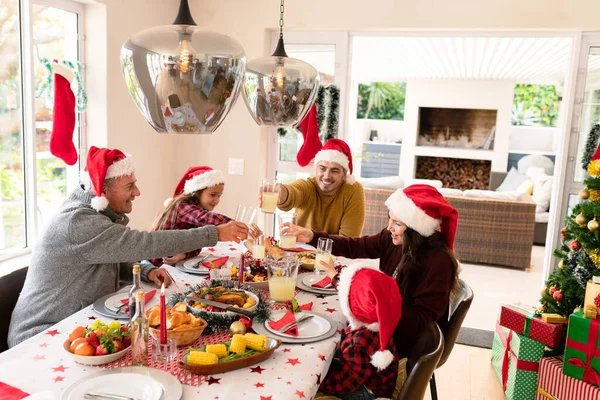Caucasian Multi Generation Family Wearing Santa Hats Having Christmas Meal — Stock Photo, Image