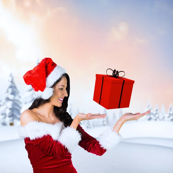 Girl presenting in santa outfit — Stock Photo, Image