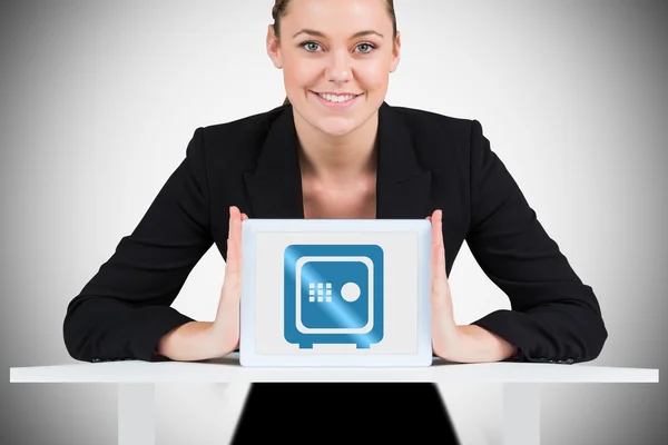 Composite image of businesswoman showing tablet pc — Stock Photo, Image