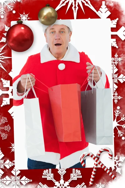 Homem festivo segurando sacos de compras — Fotografia de Stock