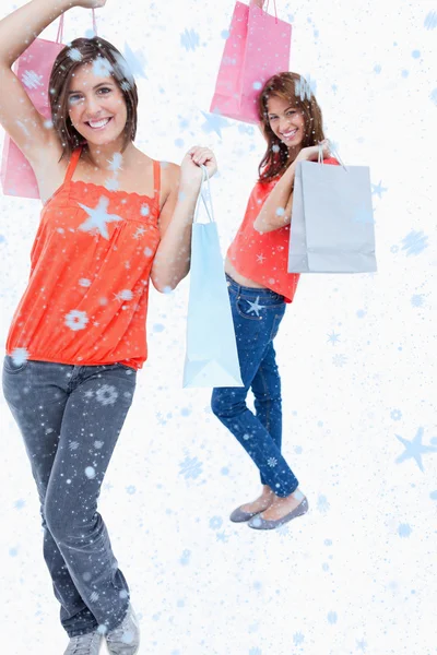 Teenage girl holding purchase bags — Stock Photo, Image