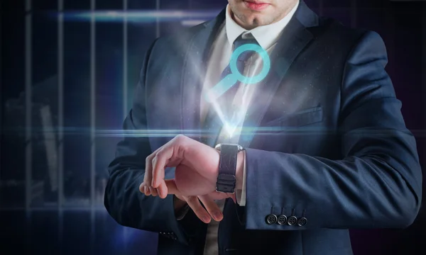 Businessman using hologram watch — Stock Photo, Image