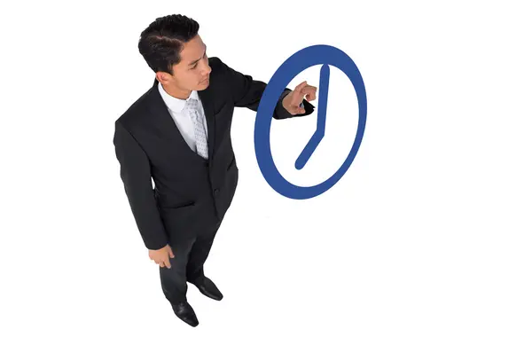 Asian businessman pointing blue clock — Stock Photo, Image