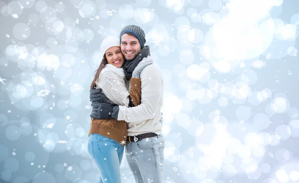 Casal de inverno jovem contra — Fotografia de Stock