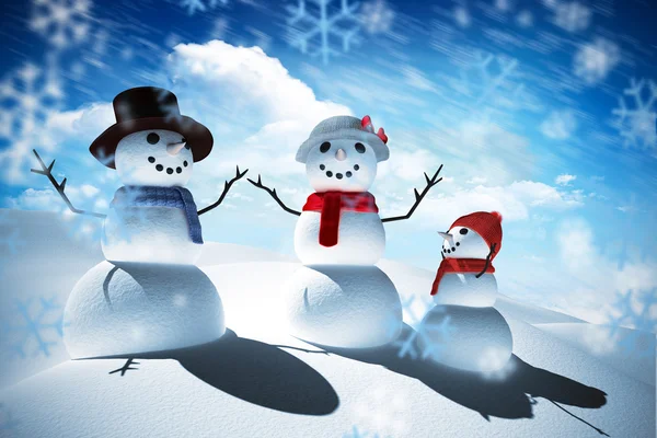 Composite image of snow man family — Stock Photo, Image