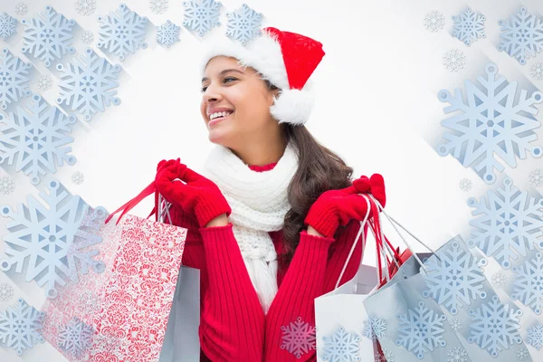 Mujer hermosa festiva sosteniendo bolsas de compras —  Fotos de Stock