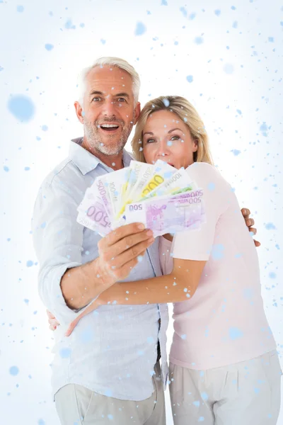 Happy couple flashing their cash — Stock Photo, Image