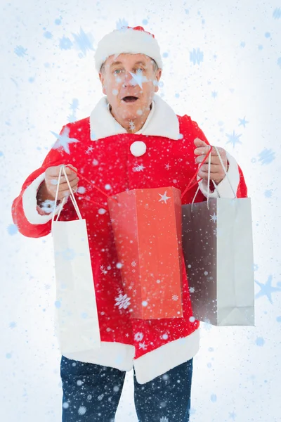 Hombre festivo sosteniendo bolsas de compras — Foto de Stock