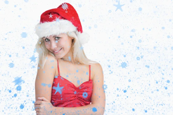 Zusammengesetztes Bild einer jungen Frau mit Weihnachtsmütze — Stockfoto