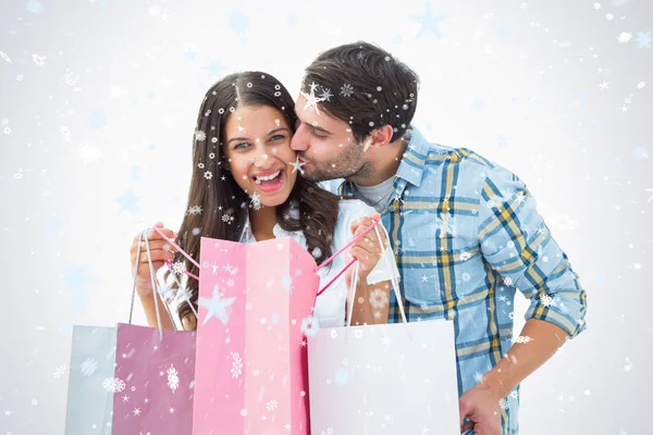 Atractiva pareja joven con bolsas de compras —  Fotos de Stock