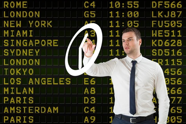 Businessman pointing to white clock — Stock Photo, Image