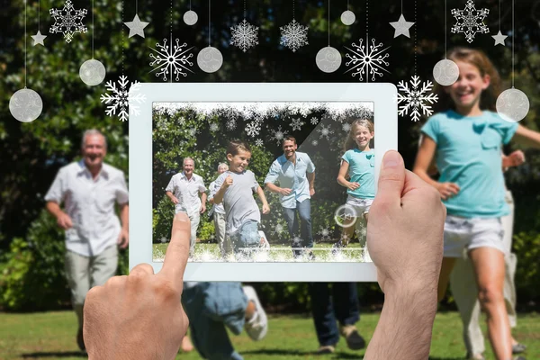 Sammansatt bild av händer som håller TabletPC — Stockfoto