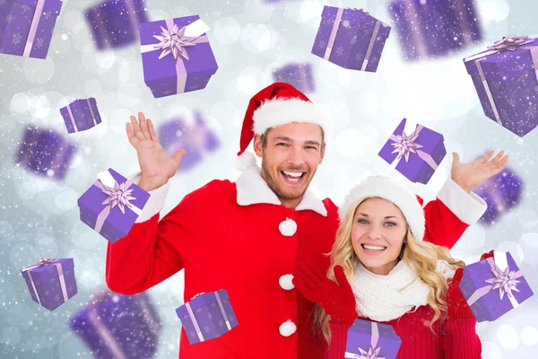 Composite image of young festive couple — Stock Photo, Image