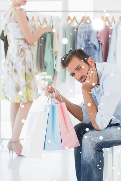 Bored man with shopping bags — Stock Photo, Image