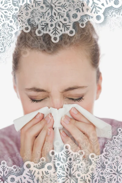 Composite image of woman blowing nose — Stock Photo, Image