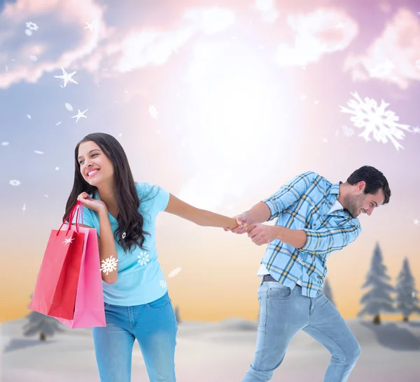 Szczęśliwa para z torbą na zakupy — Zdjęcie stockowe