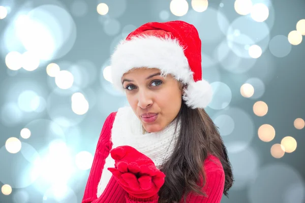 Image composite de soufflage brunette festive Image En Vente