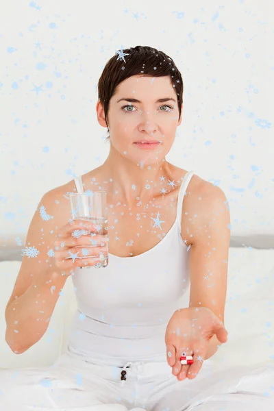 Young woman taking pills — Stock Photo, Image