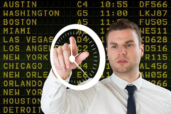 Businessman pointing to white clock — Stock Photo, Image