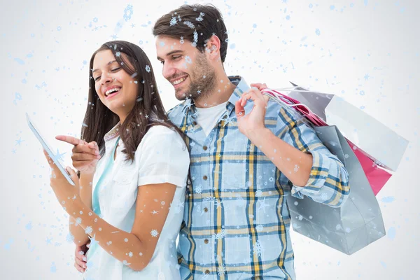 Atractiva pareja joven con bolsas de compras —  Fotos de Stock