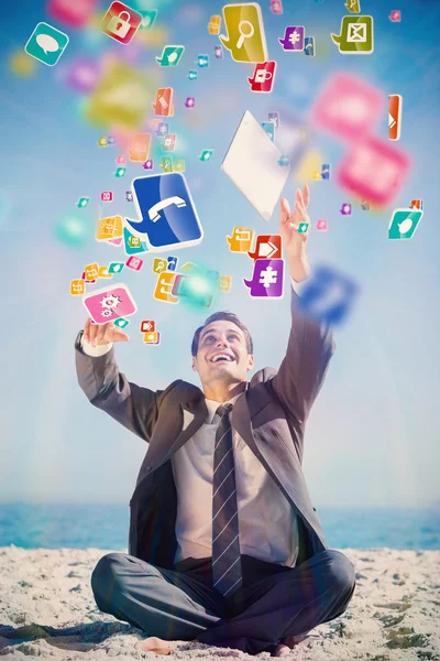 Businessman juggling with his tablet — Stock Photo, Image