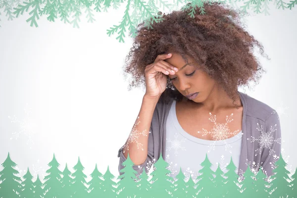 Sad woman holding her forehead with her hand — Stock Photo, Image