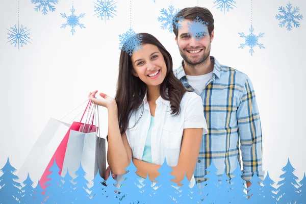 Attraente giovane coppia con shopping borse — Foto Stock