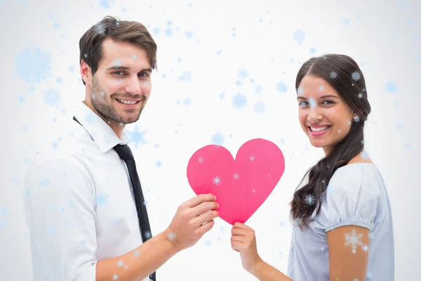 Pretty brunette giving boyfriend her heart — Stock Photo, Image