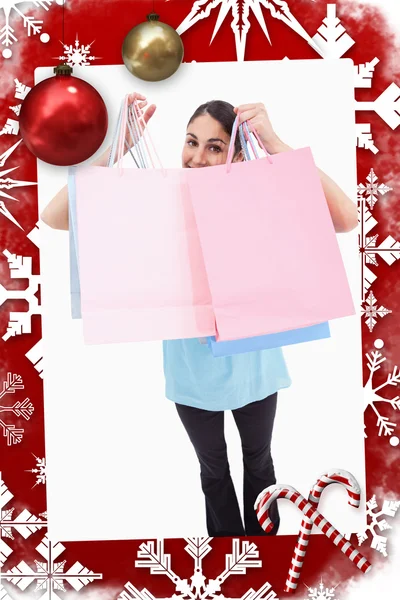 Joyful woman showing shopping bags — Stock Photo, Image