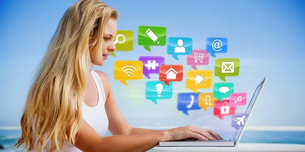 Blonde using her laptop at the beach — Stock Photo, Image