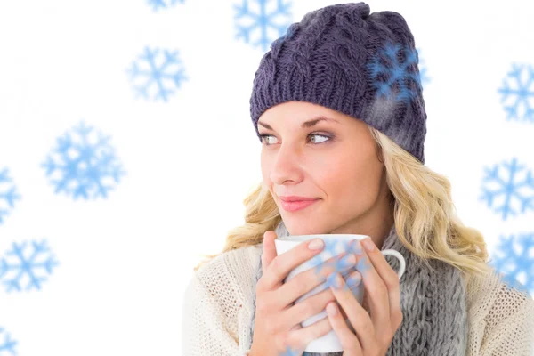 Blonde in winter fashion holding mug — Stock Photo, Image