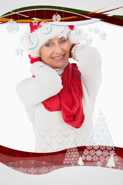 Imagen compuesta de mujer festiva sonriendo a la cámara — Foto de Stock