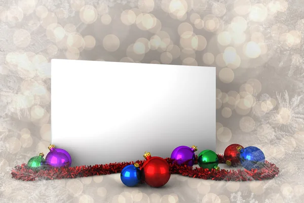 Composite image of poster with baubles — Stock Photo, Image