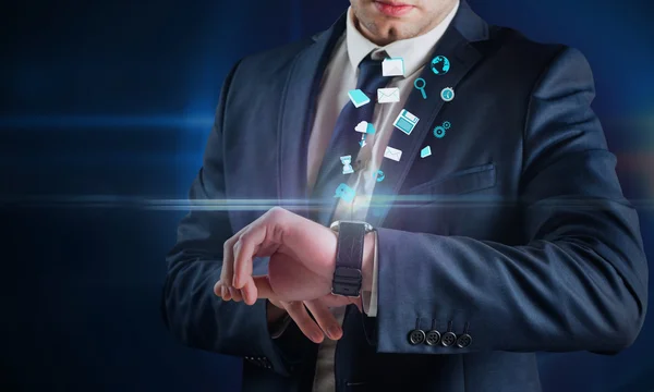 Businessman using hologram watch — Stock Photo, Image