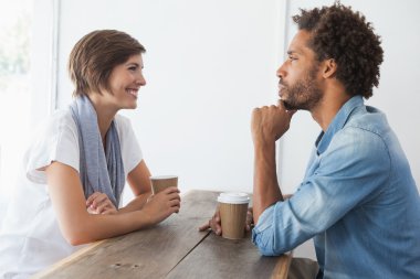 Casual couple having coffee together clipart