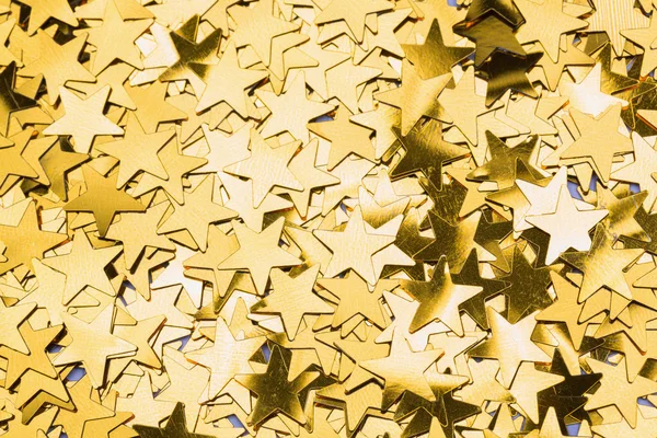 Molte stelle d'oro decorazioni sfondo — Foto Stock