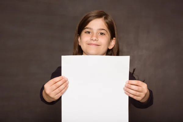 Cute pupil showing white page — Stock Photo, Image