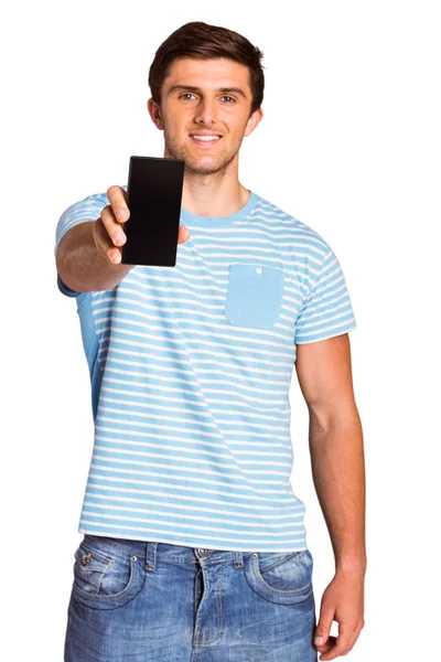 Jovem mostrando telefone para câmera — Fotografia de Stock